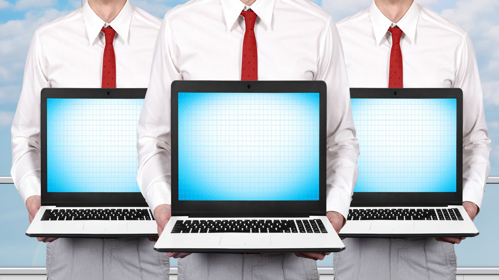Three laptops side by side showing task managers for Windows 10, Windows 11, and Linux
